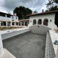 Pool Deck Materials Compared: Concrete, Pavers, Travertine, and Wood — Which Is Best?